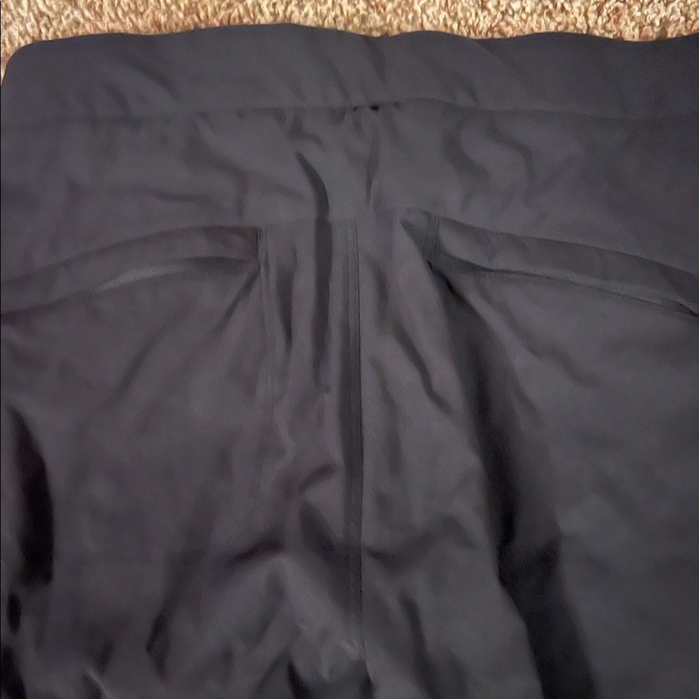 Athleta size 4 black pants. Stretchy. Pull-string cuff, pockets & side zippers. - Picture 6 of 7